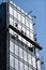 Construction workers on a suspended platform on a skyscraper