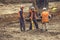 Construction workers using magnetic locator