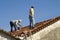 Construction workers at work on a roof, Portugal