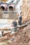 Construction works on large iron pipes at a depth of excavated trench