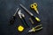 Constructor desk with set of building implements dark desk background top view