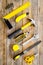 Constructor desk with set of building implements wooden desk background top view