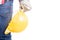 Constructor hand holding yellow helmet