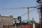 Constrution crane in front of high rise buildings in downtown Johannesburg