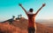 Consuegra Windmills and happy woman arms raised admiring panoramic view- Spain