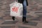 CONSUERS WITH SWEDISH CHAIN H&M SHOPPING BAG