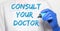 Consult your doctor inscription text. professional treatment