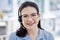 Consultant, portrait of woman call center agent and with headset at her workplace office with smile. Customer service or