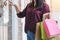 Consumerism, shopping lifestyle concept, Young woman holding col