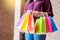 Consumerism woman holding many shopping bags in fashion boutique