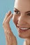 Contact eye lens. Smiling woman applying eye contacts closeup