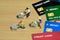 Contact-less payment. Group of people shopping using electronic money e-money. Miniature people figurines toys conceptual