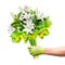 Contactless flower delivery, male courier in medical gloves with a bouquet