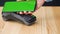 Contactless payment with your smartphone with green mock-up screen. Wireless payment concept. Close-up, woman using