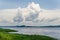 Container cargo ships on mighty Congo river with dramatic sky