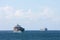 Container cargo ships passing at sea