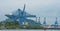 Container cranes loading a ship in port in Panama.