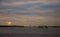 Container cranes in New York harbour at sunset and Statue of Liberty