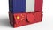 Container with flag of France breaks cargo container with flag of China. Trade war or economic conflict related