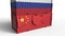 Container with flag of Russia breaks cargo container with flag of China. Trade war or economic conflict related