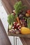 Container full of fresh vegetables on kitchen counter close-up elevated view