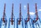 Container gantry cranes with upright lifted booms