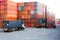 Container handlers and trucks In the loading and unloading yard