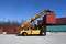 Container handling vehicle in action