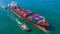 Container ship arriving in port, Tug boat and container ship going to deep sea port, logistic business import export shipping and