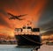 Container ship and container in shipping port cargo plane flying above