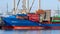 Container ship loaded by gantry cranes in the Port of Rotterdam. The Netherlands - September 8, 2012