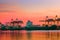 Container ship at logistic port against beautiful sunset sky