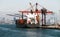 The container ship moored in the cargo port of Istanbul against the background of the panorama