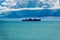 Container Ship in the Sea under Cumulonimbus Clouds with Rain