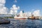 Container ship and tugboat entering harbor