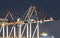 Container Ships Being Unloaded At Night.