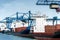 Container terminal with gantry cranes and unloaded cargo ships a