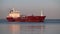 A containerized cargo ship enters the port for unloading