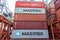 Containers loaded on deck of cargo ship.