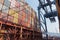 Containers loaded on deck of cargo ship.