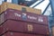 Containers loaded on deck of cargo ship.