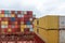 Containers loaded on deck of cargo ship.