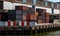 Containers old, rusted at harbor of Rotterdam, Netherlands. Logistics business, cargo loading unloading