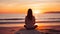 Contemplating Sunrise: A Woman\\\'s Meditation At The Beach