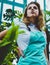 contemplative caucasian woman in casual apron looking away in warmhouse