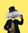 Contemporary art collage. Male body wearing black suit and tall hat headed of cumulus tastes beer. Concept of dreams