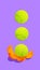 Contemporary art collage. Modern creative artwork. Alternative food. Tennis balls falling down to orange colored