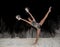 Contemporary ballet dancer dancing on the stage with flour