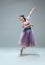 Contemporary ballroom dancer on grey studio background