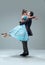 Contemporary ballroom dancers on grey studio background